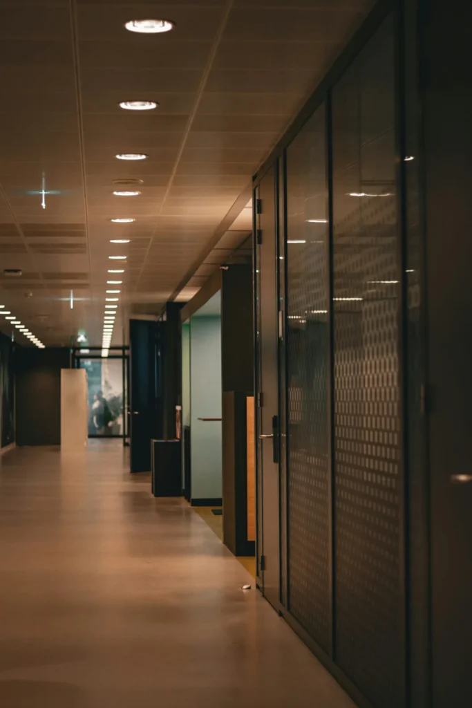 A hallway of glass offices