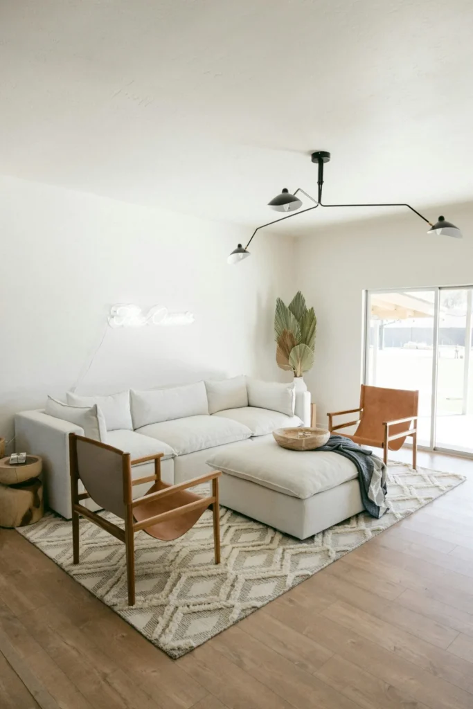 A bright sitting room with couches and chairs